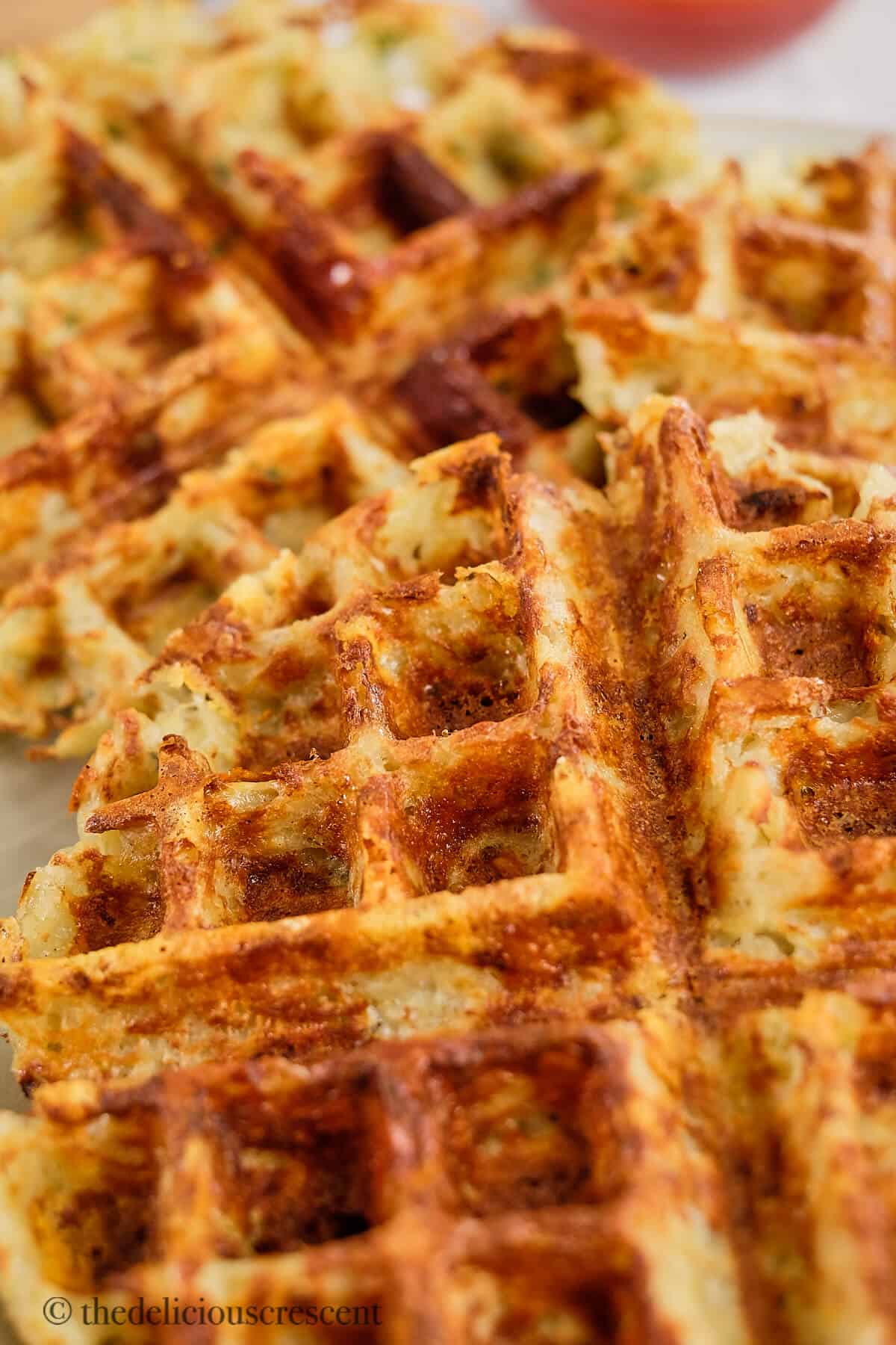 https://www.thedeliciouscrescent.com/wp-content/uploads/2022/10/Potato-Waffles-1.jpg