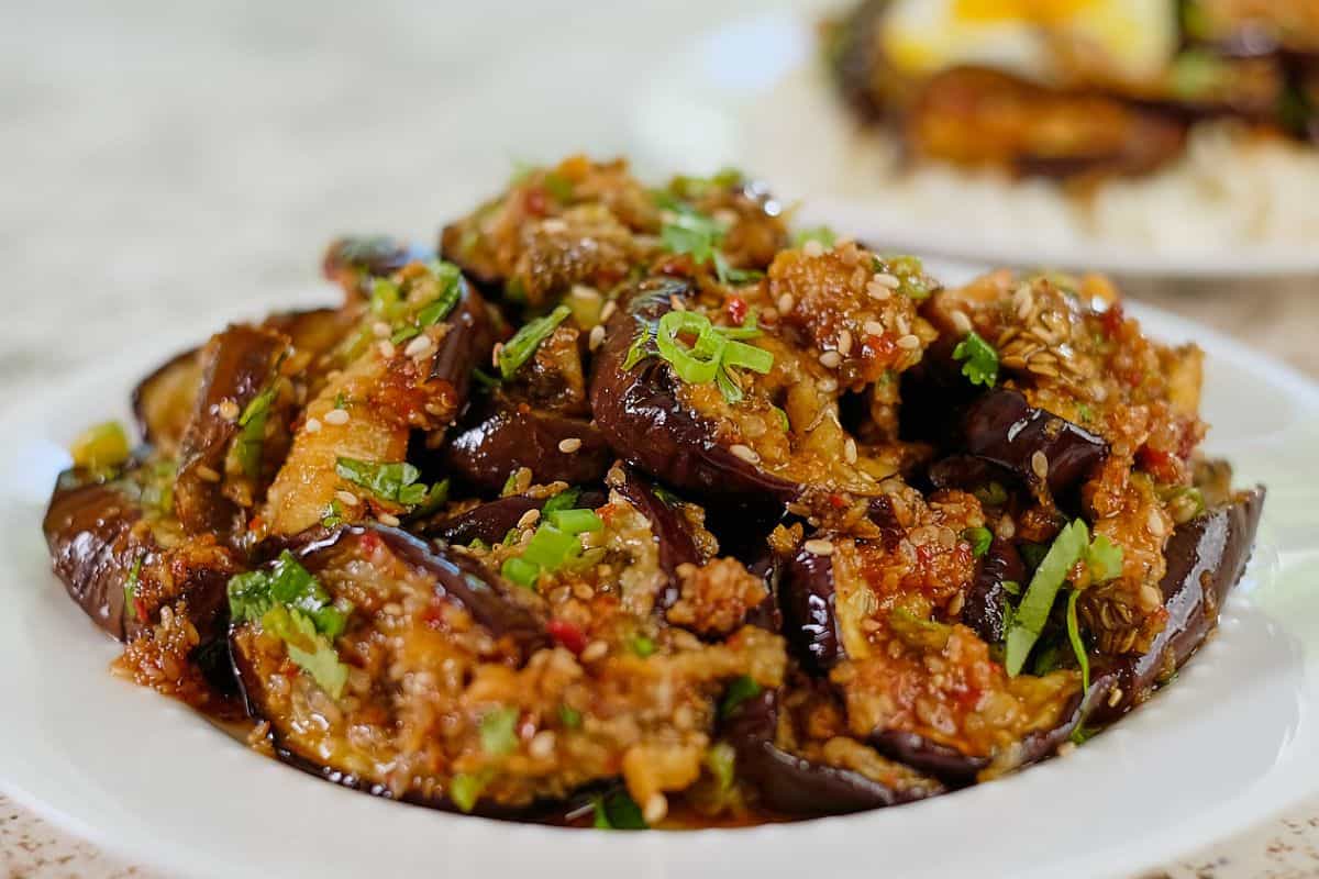 Asian eggplant recipe roasted and served in a bowl.